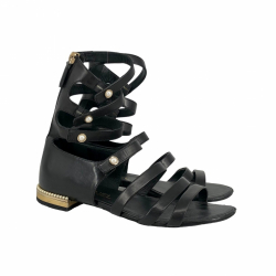 Chanel gladiator sandals in black leather with faux pearl buttons