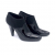 Prada ankle boots in black patent leather and fabric