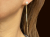 Saks Fifth Avenue Kaskadenförmige Ohrringe aus Gold und Perlen