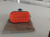 Bottega Veneta Knot Clutch en soie orange et profils  en serpent' d'eau