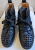 Christian Louboutin Schwarze Sneakers aus Leder und Spikes 37