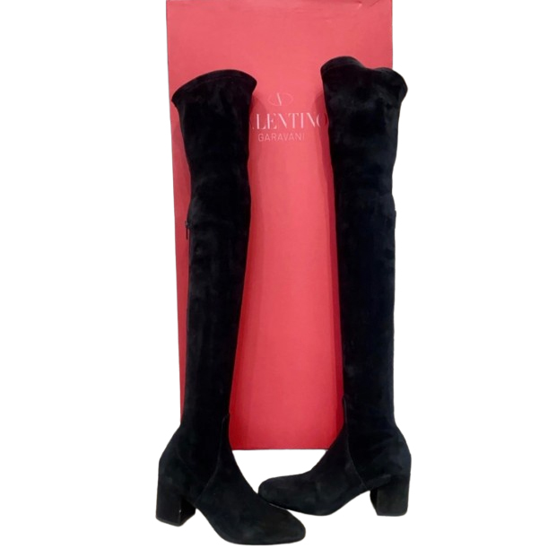 Valentino Bottes Garavani en cuir et daim sur les genoux