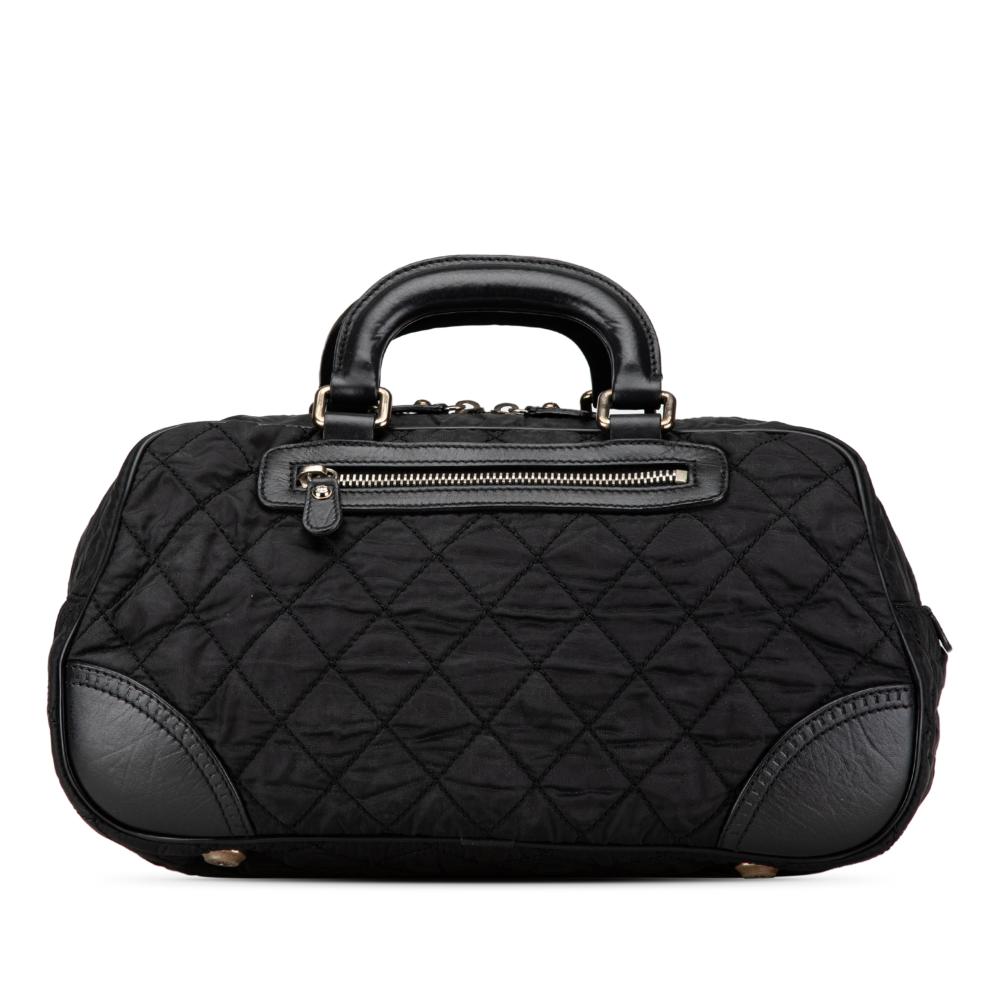 Chanel B Chanel Black Nylon Fabric Paris New York Quilted Duffle Handbag Italy