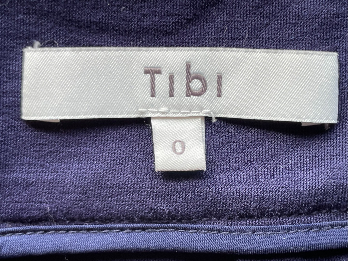 Tibi high-waisted wide-leg cropped trousers, in a soft navy viscose.