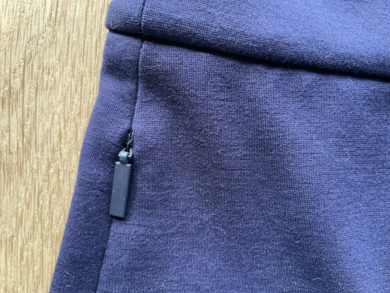 Tibi high-waisted wide-leg cropped trousers, in a soft navy viscose.