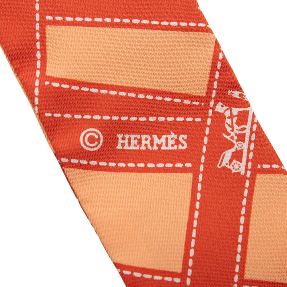 Hermès A Hermès Orange Silk Fabric Bolduc Twilly Scarf France
