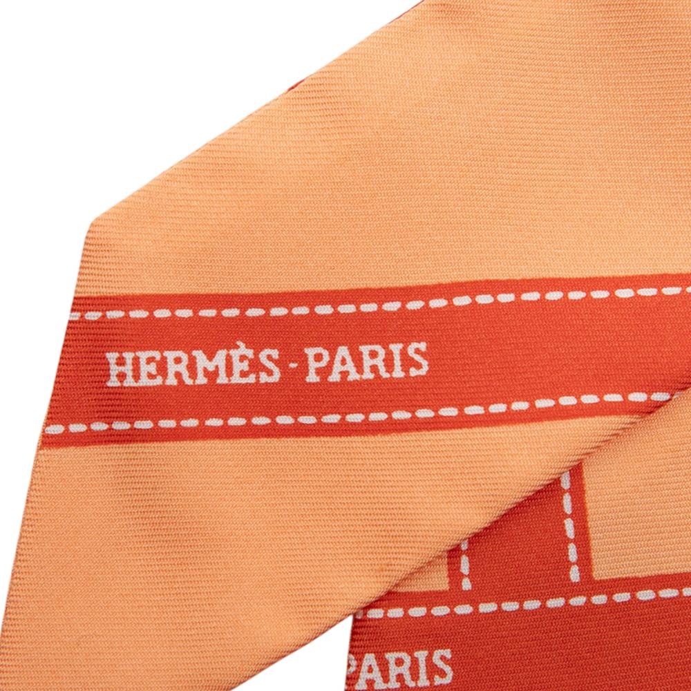 Hermès A Hermès Orange Silk Fabric Bolduc Twilly Scarf France