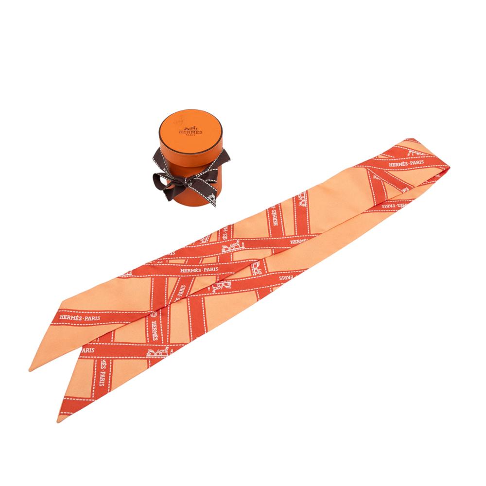 Hermès A Hermès Orange Silk Fabric Bolduc Twilly Scarf France