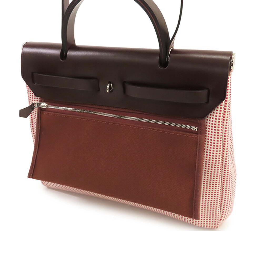 Hermès AB Hermès Red Canvas Fabric Toile Criss Viking Vache Hunter Herbag Zip 31 France