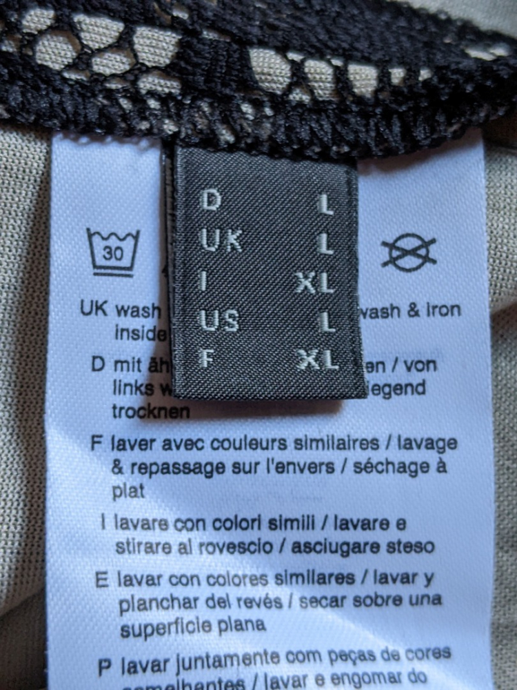 Esprit Black lace dress on cream background L