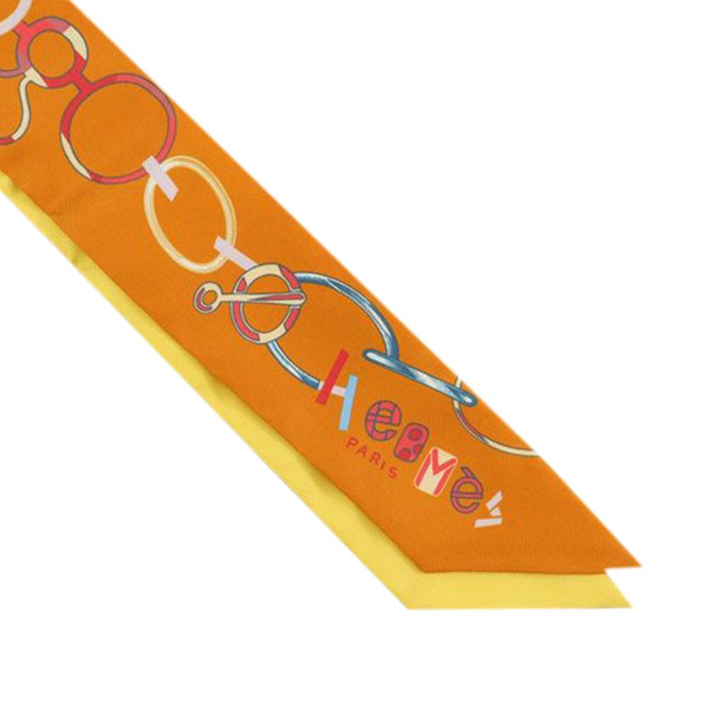 Hermès A Hermès Orange Silk Fabric Do Re Boucles Twilly Scarf France