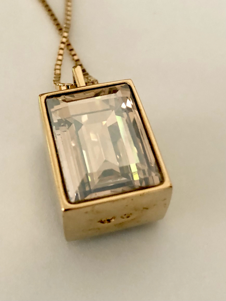 Swarovski Collier avec pendentif double face.