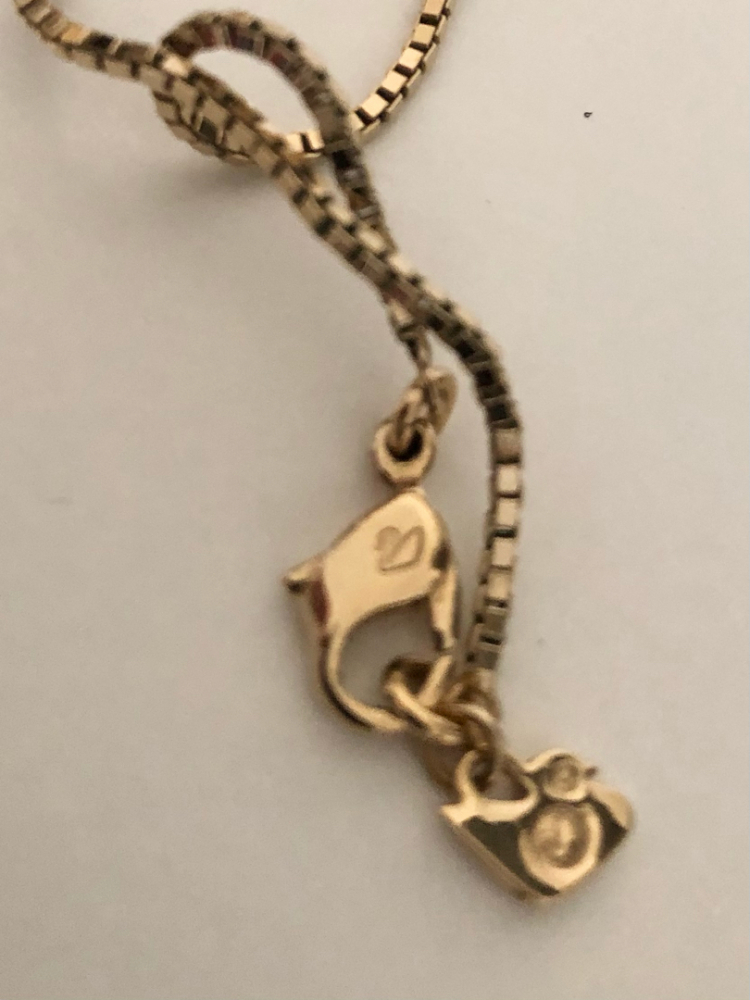 Swarovski Collier avec pendentif double face.