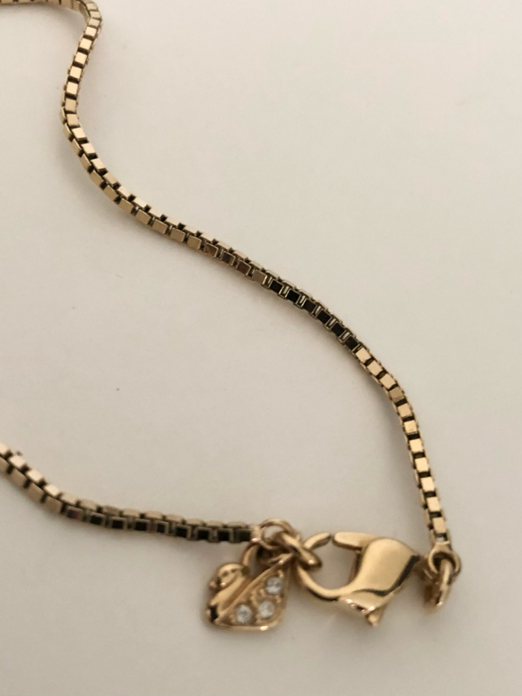 Swarovski Collier avec pendentif double face.