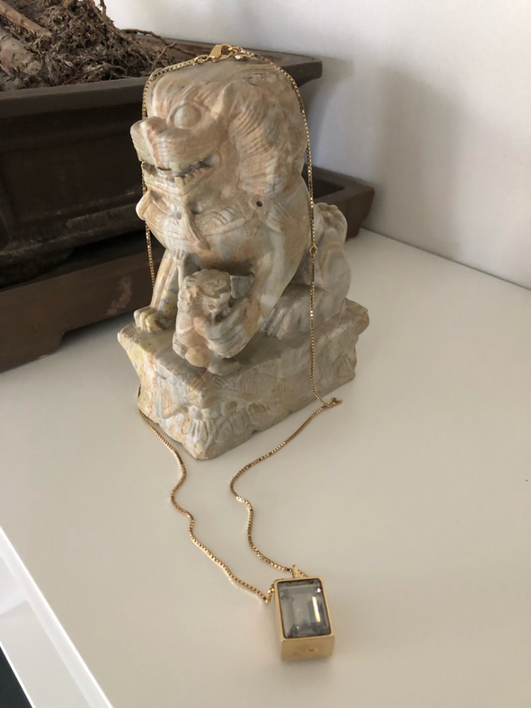 Swarovski Collier avec pendentif double face.