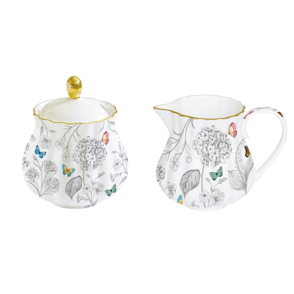 Porzellan-Milchkännchen Und Zuckerdose Im Fleurs Et Papillons Farbkarton