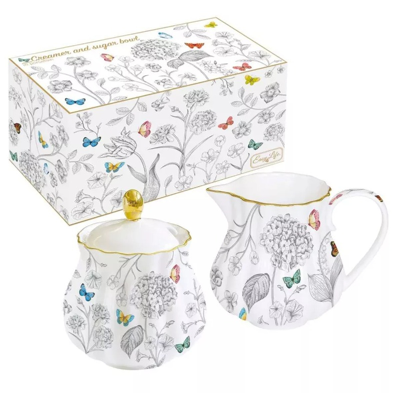 Porzellan-Milchkännchen Und Zuckerdose Im Fleurs Et Papillons Farbkarton