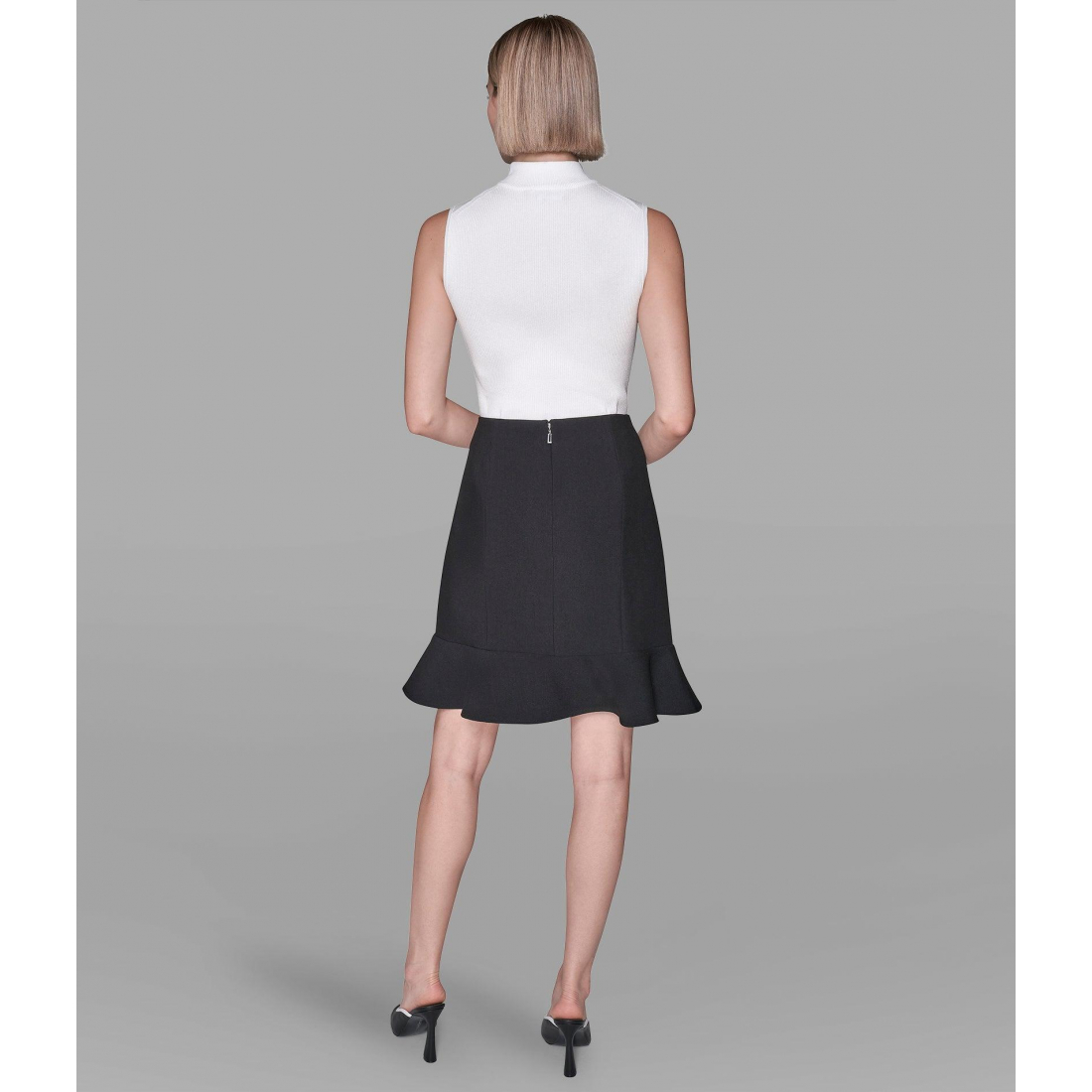 'Button-Detailed Mini Peplum Skirt' pour Femmes